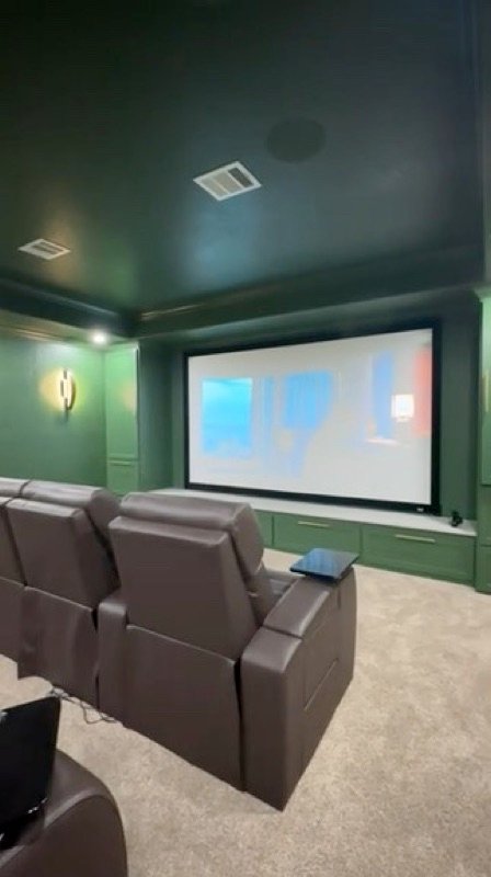 Green home theater with leather seating