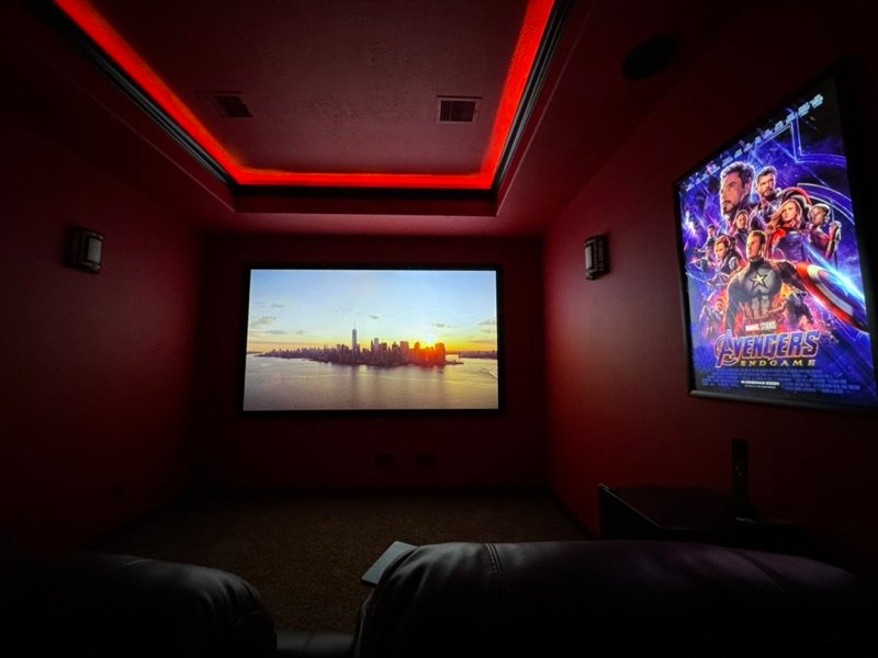 Custom home theater with red LED cove lighting