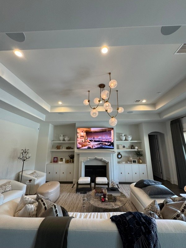 Living room media setup with in-ceiling speakers