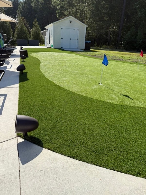 Outdoor landscape audio by backyard putting green