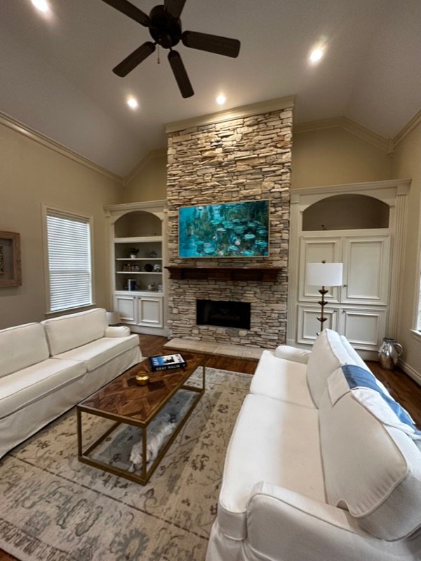 TV mounted on custom stone fireplace